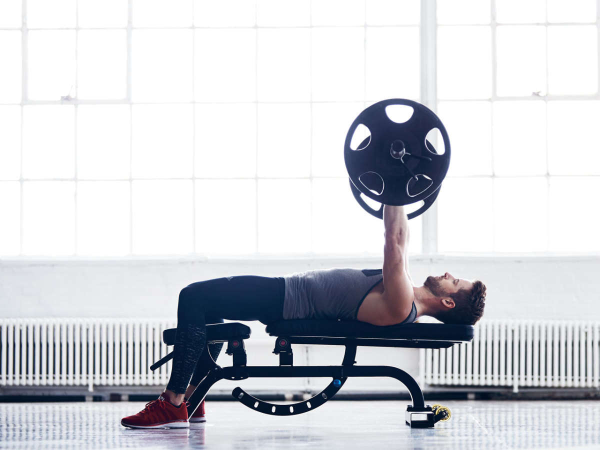 Chest and tricep workout - Man performing bench press - pharmafoodhealth