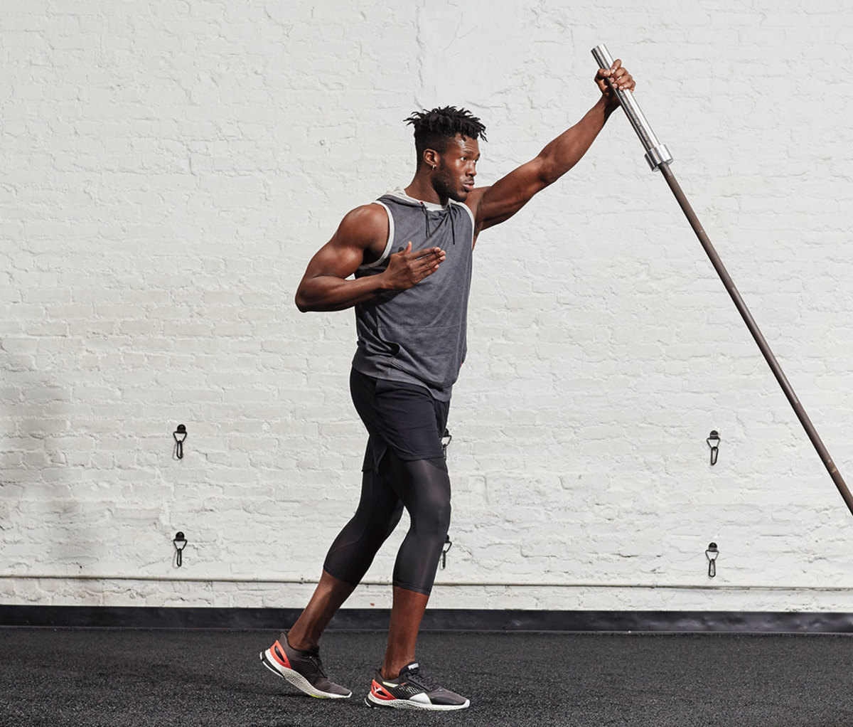 Chest and triceps workout Landmine Standing Reach Pharmafoodhealth